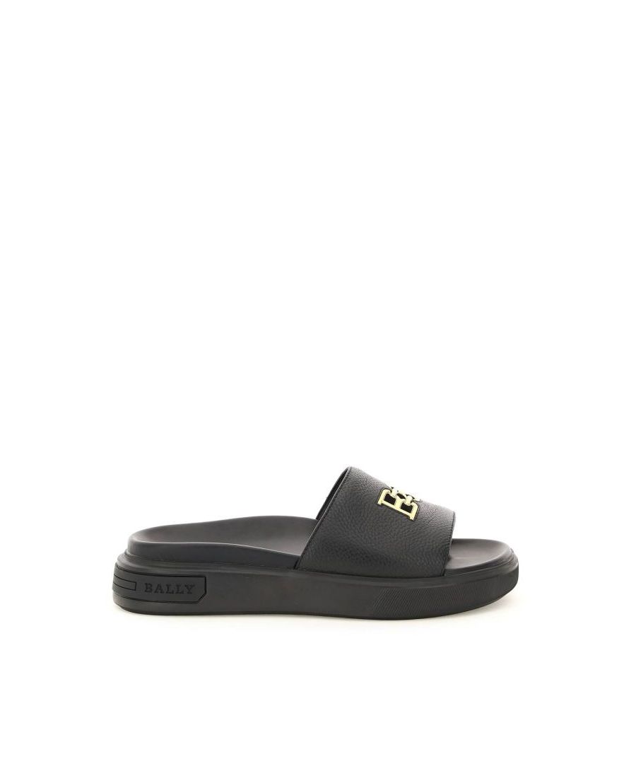 Jaxons slides by Bally crafted in grained leather with gold-tone B-Chain inlay on the upper band. Smooth leather moulded footbed, rubber sole with logoed inlay on the back. 