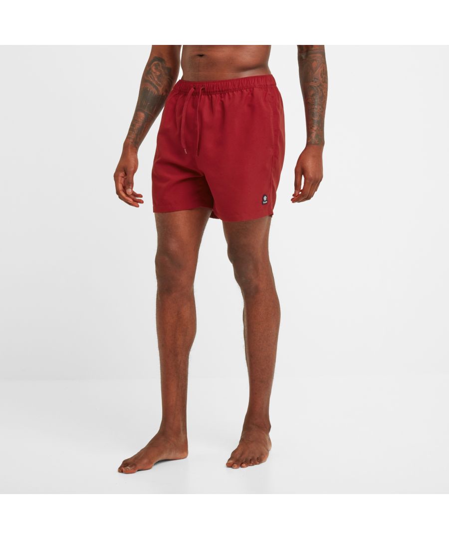 Built to last, quick to dry and eco-friendly, our Tristan swim shorts have all the credentials you need to be beach and pool ready. These classic bathers come in a range of fun, seaside colours inspired by a trip to Whitby Bay in Yorkshire and are made from a lightweight, 100% recycled water-repellent fabric. Tristan swimming trunks have a supersoft inner mesh brief for all day comfort and an elasticated drawstring waist for a secure, custom fit. You’ll find two handy pockets at the hip as well as an extra pocket at the back to store your essentials. Designed by our team in West Yorkshire, they are finished with our signature embroidered Yorkshire Rose badge just above the hem.