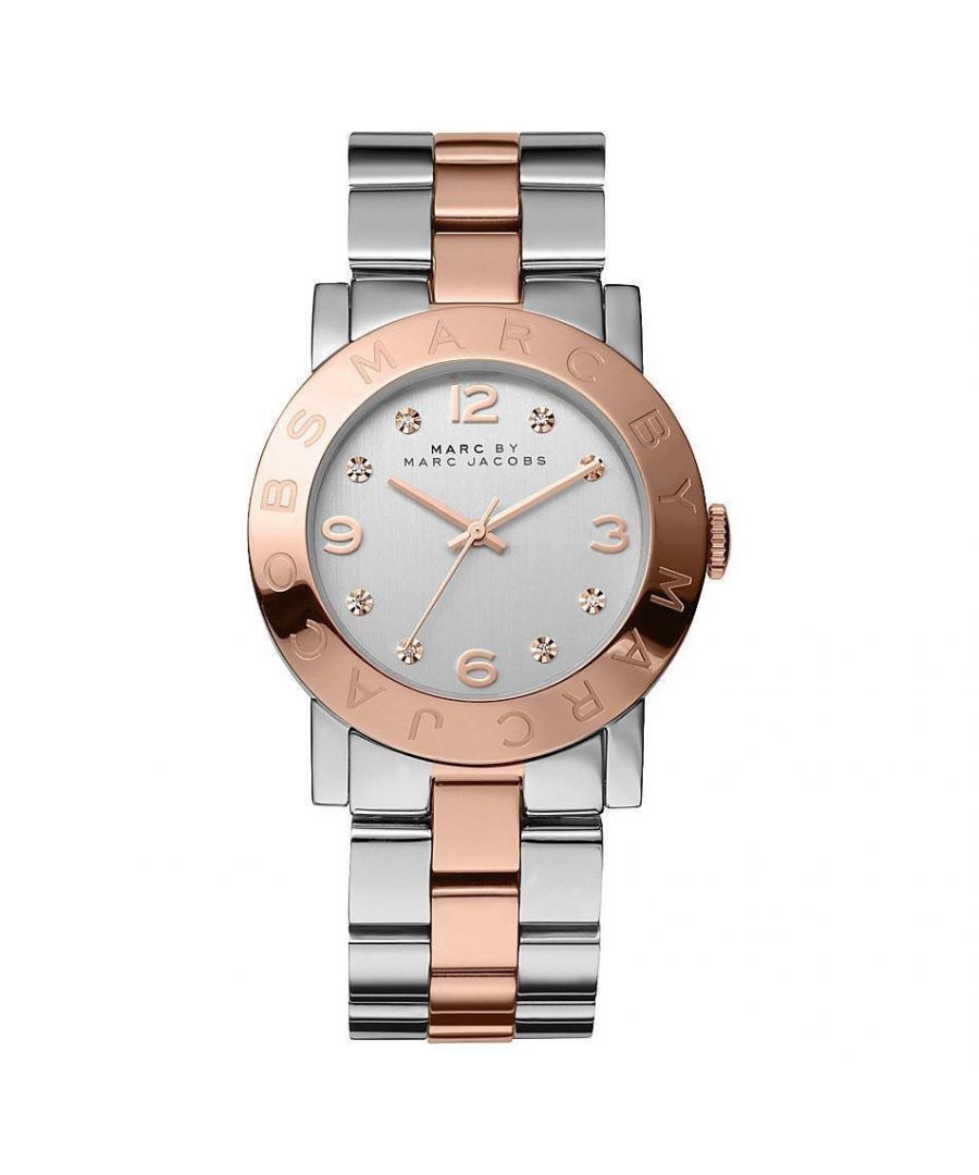 PRODUCT INFO - Case Diameter: 36mm   Case Material: PVD Rose Plated Stainless Steel   Water Resistant: 50 Metres\tMovement: Quartz (Battery) Dial Colour: White   Strap Material: Two Tone PVD Rose Plated Tone Stainless Steel   Clasp Type: Push-Button Deployment   Gender: Female\t\n\nDESCRIPTION - This elegant piece blurs the lines between jewellery and timepiece, making it perfect for the fashion- forward female. It is made from a Two Tone PVD Rose Plated stainless steel bracelet and has a sleek bracelet design in Rose Gold / Silver Tone metal and fastens with a push-button deployment. FREE Home Delivery - Including Next Day Service*. Available for gift wrap. We offer free bracelet adjustment service on this product. Please contact customer services for Returns policy