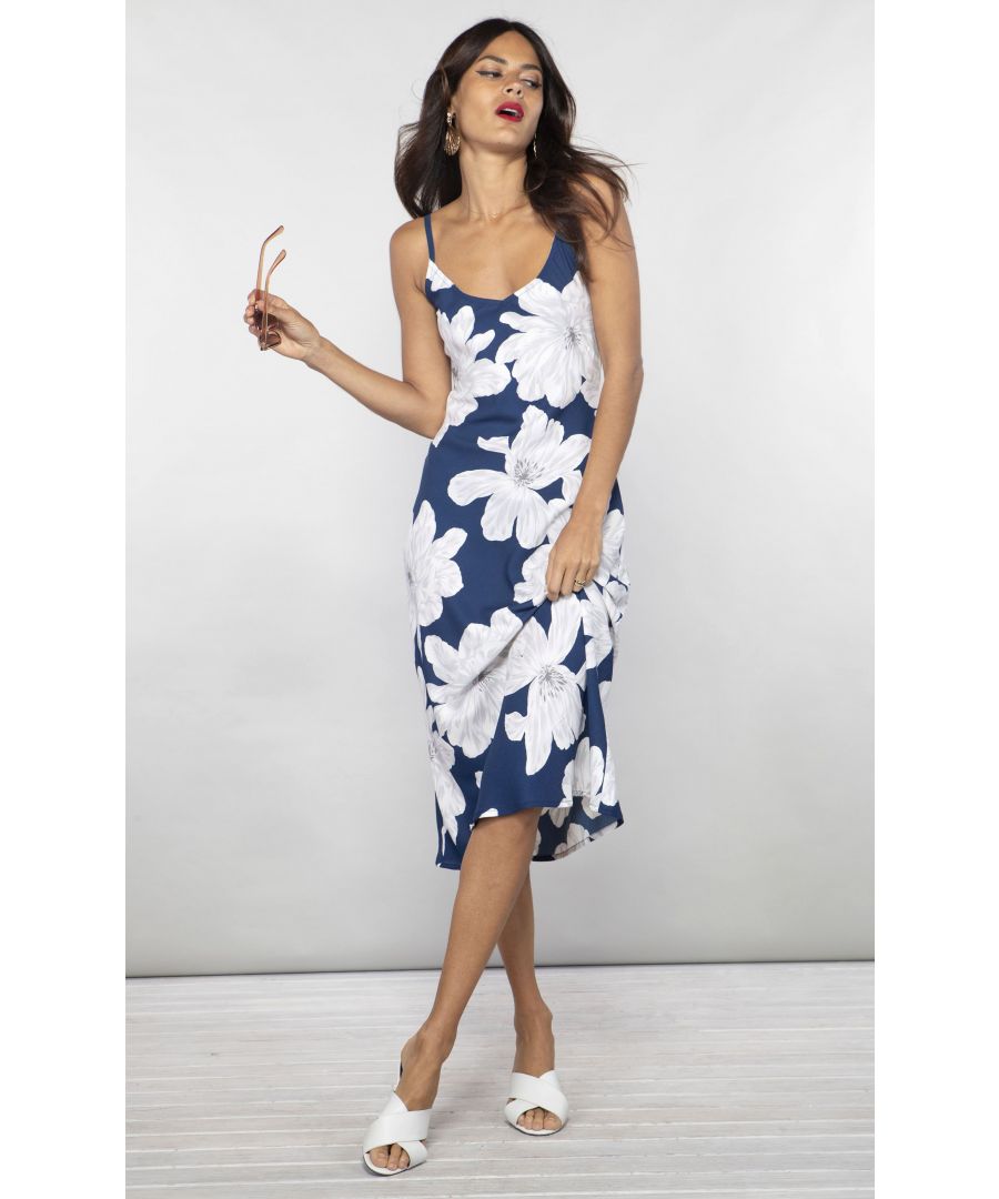 Midi length dress with adjustable straps and curved neckline to the front and back