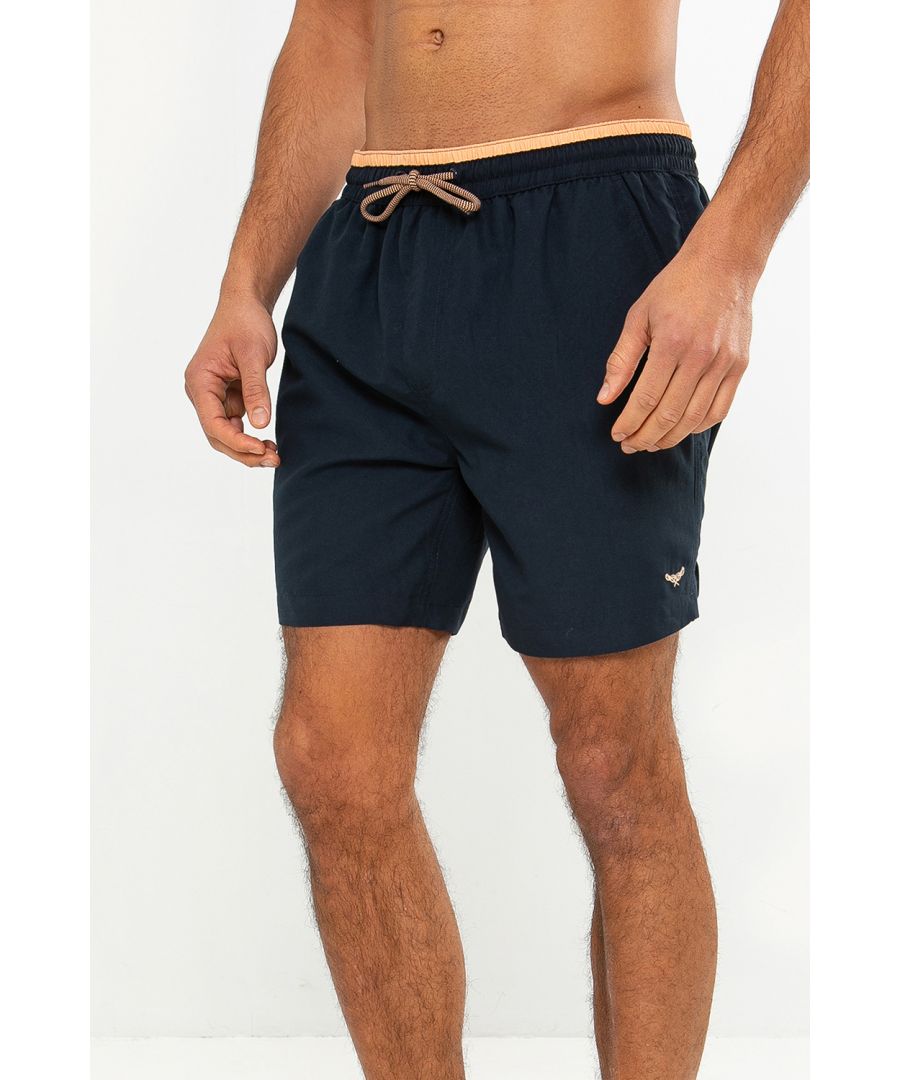 These swim shorts from Threadbare are made of quick-drying, soft-touch polyester with a mesh liner. They feature an adjustable draw cord waist and 2 side pockets. Perfect for the beach or by the pool.