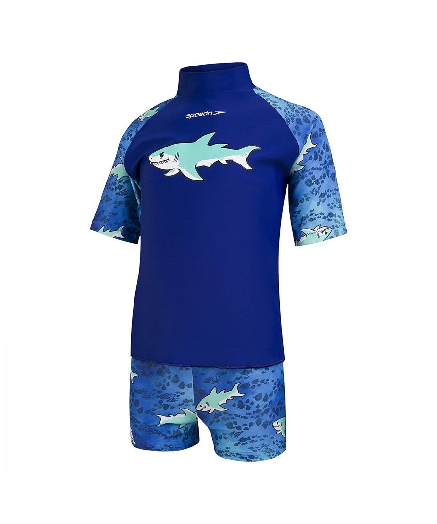 The Speedo Sun Protect Junior Boys Top and Short Set is perfect to keep little ones protected on sunny holidays and for days outdoors. The pull on sun top allows for easy on/off access and provides sun protection for the shoulders, arms and tummy.  The UV protective fabric provides the ultimate protection with a UPF 40+ rating. The set is of higher chlorine resistance than standard swimwear fabrics meaning that it fits like new for longer with CREORA HighClo material. The fabric stretches so that little ones can enjoy their day without feeling restricted. Finished with a shark design all over.