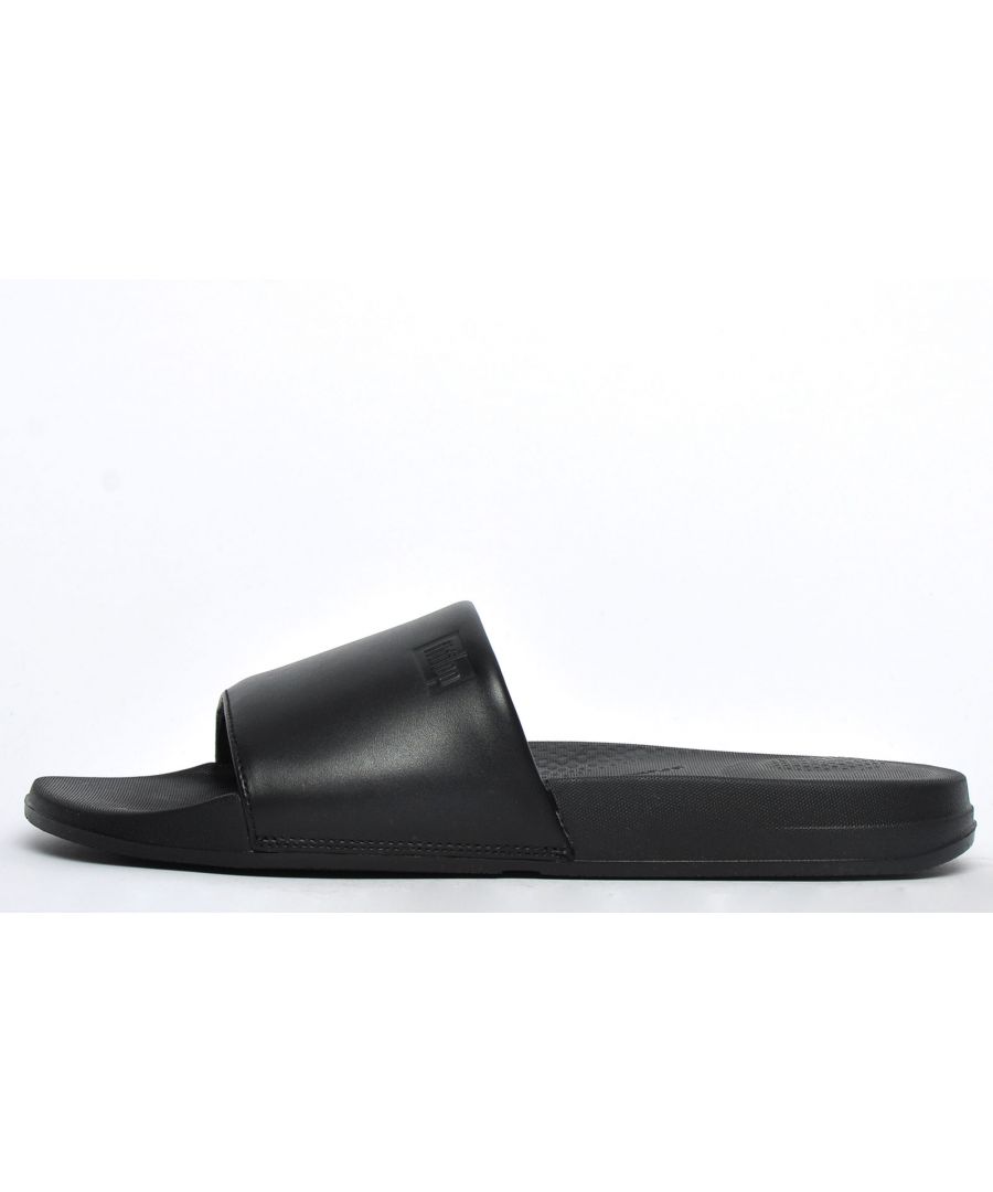Level up your casual summer wear with these FitFlop iQushion mens slides, boasting a premium leather upper that offers a sophisticated take on the classic slide silhouette. These iQushion mens slides feature exclusive iQushion midsole technology to deliver an ergonomically shaped footbed with high-rebound, air-foam cushioning to provide natural arch support and shock absorption. The leather foot strap in an on-trend black colourway provides a stylishly sophisticated look whilst keeping feet secure. Look no further for a practical and comfortable choice in mens slides, FitFlop has you covered!\n - Leather upper\n - Slip on design\n - iQushion midsole for enhanced comfort\n - Ergonomic foot arch for support\n - Rubber outsole for traction\n - FitFlop branding