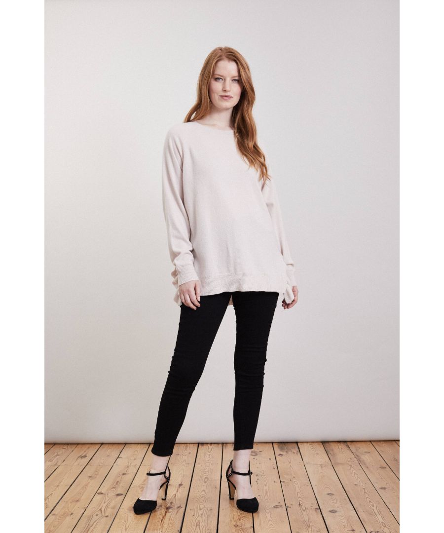 A relaxed sweater with added ruffles. Our longline sweater has a stepped hem with statement split sides decorated with soft ruffles. Great for layering over shirts and jersey. Wear yours over denim or cashmere joggers for a down time treat or style up with skinnies and heels.