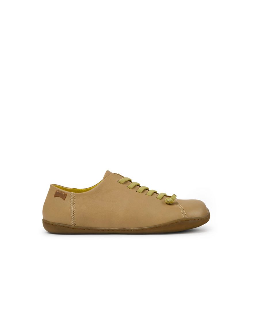 Beige leather men's shoes with 100% TPU outsoles (20% recycled).\n\nA Camper Icon that evolves with every season. Peu is functional simplicity inspired by walking barefoot. It is 360-degree stitched and built with a Strobel construction technique, guaranteeing unmatched flex and durability under any conditions.