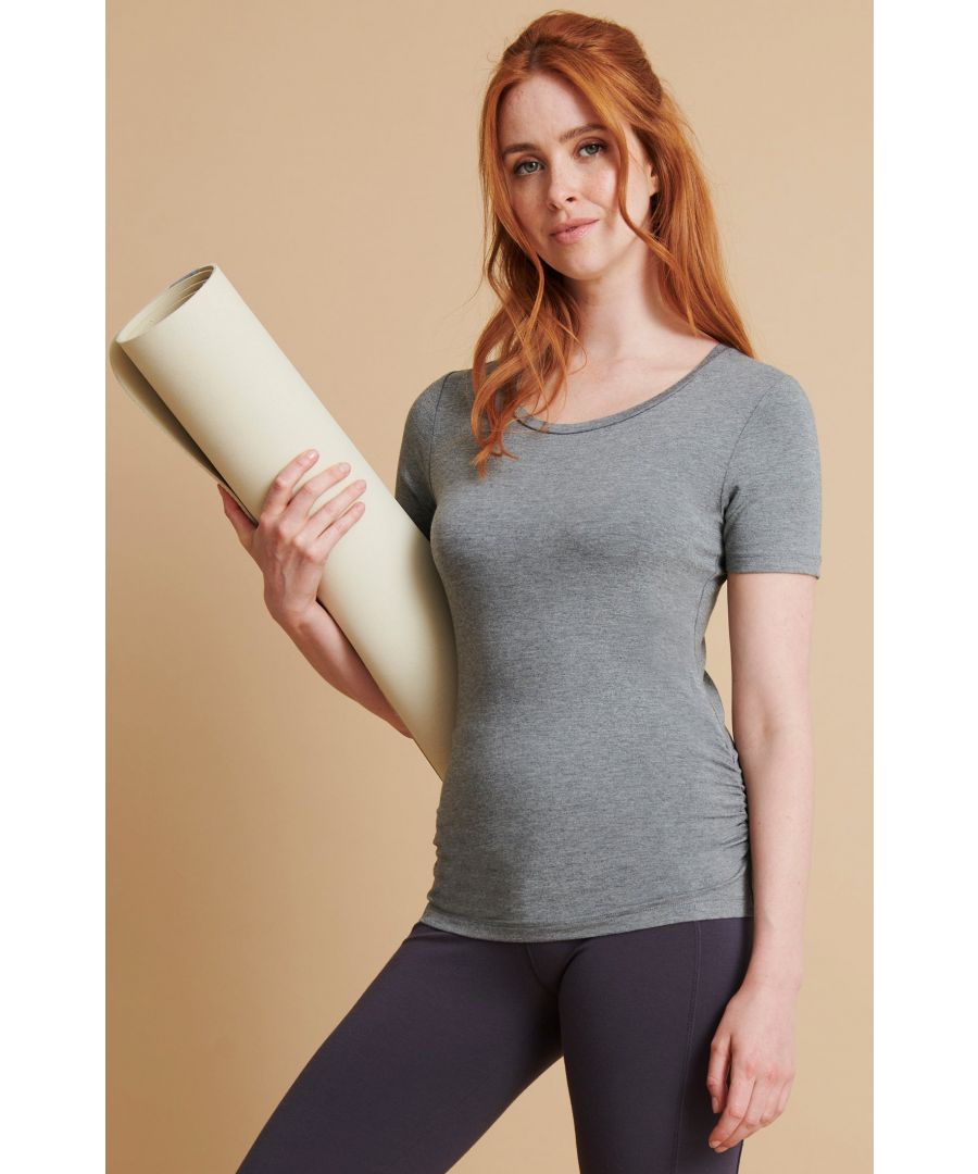 This is the classic bamboo tee with a few flattering twists. The adjustable side gathers means you can choose how high or low you want it to sit and softens your look. \n\nDesigned for Yoga and Pilates\nMade with 95% Bamboo Viscose, 5% Elastane\n\nUnrivalled softness and great for sensitive skin\n\n\nNaturally sweat-wicking and breathable \n\n\nFrom responsibly managed, FSC certified forests\n\n\nOeko-Tex certified no nasties in the dyeing process\n\nSelf-fabric tie adjusters \nSide gathers at the hip\nLonger length to cover bottom and thighs\n\nGreat for all sporting activities 