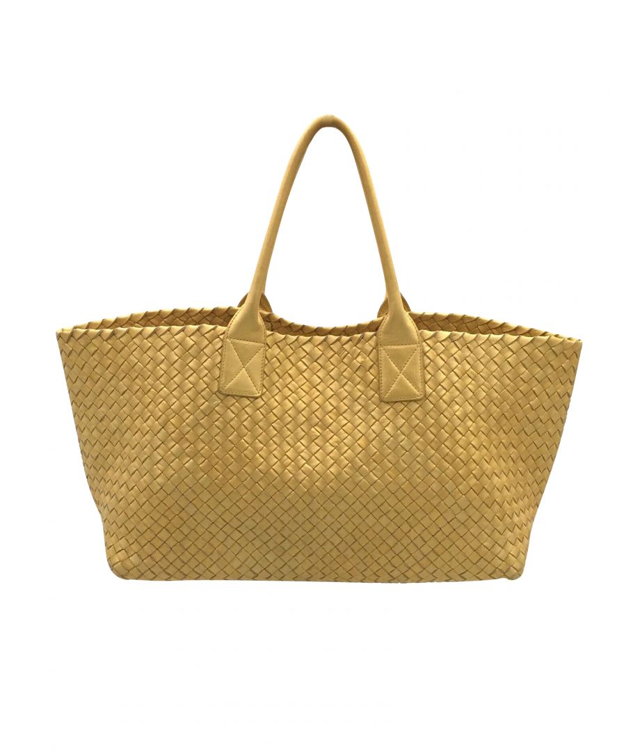 VINTAGE. RRP AS NEW. Limited edition 248/500.The classic cabat from Bottega Veneta. Small size.\nIn a light metallic dusted yellow colour.Open top, can be worn in a rectangular or triangle shape.Inside unlined. With pouch in golden-yellow smooth leather attached on leather strap. 27 x 16.5 x 0.25cm40 x 25 x 18cmNo code visible. This bag has been authenticated by experts.Good condition (6.9/10).  Light wear on corners, bottom and edges of nappa. Wear and cracking on handles. Some marks on inner and light scuffs on smooth leather parts. One thread undone on inner handle. Perfect entry price for the beginner BV collector! No dust bag.Box NoDust bag NoSeason All seasons\nBottega Veneta Bottega Veneta PM cabat in intrecciato nappa metallic light yellow gold\nColor: yellow\nMaterial: Leather\nCondition: good\nSize: One Size\nSign of wear: No\nSKU: 89748 / UT203329