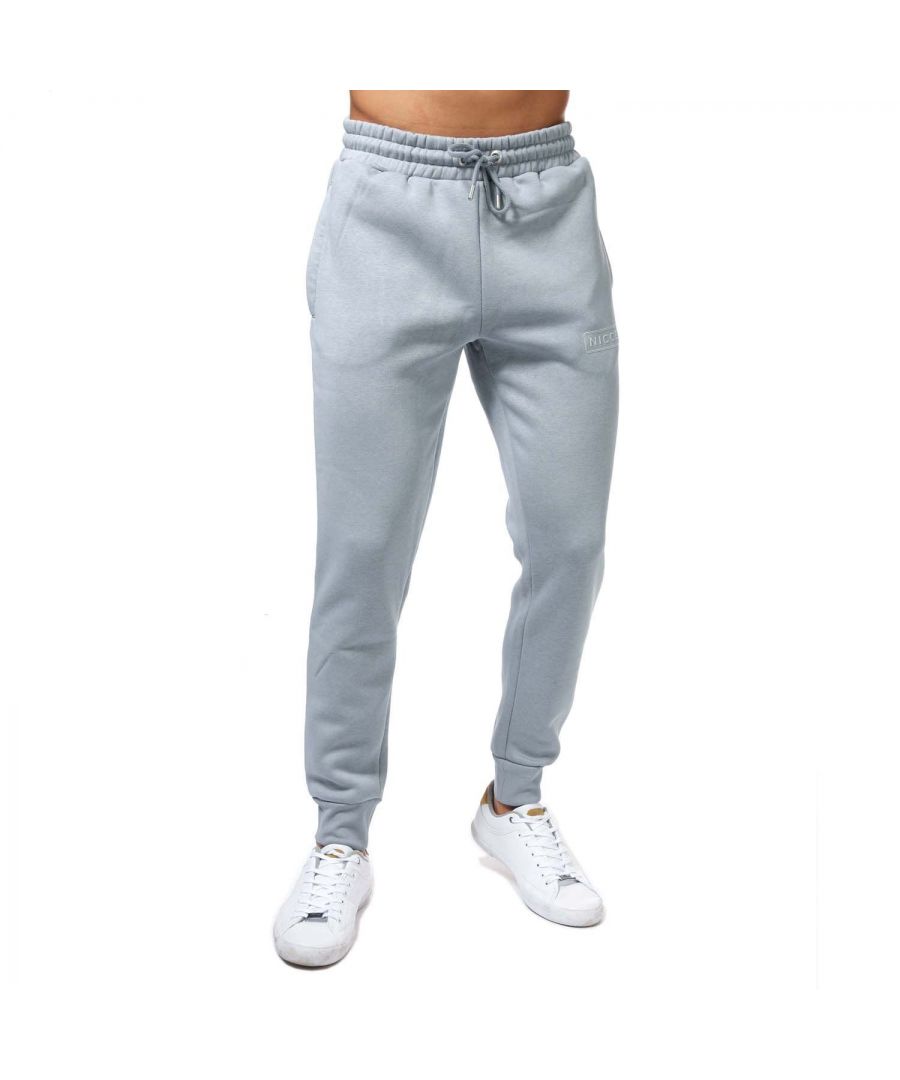 Mens NICCE Plinth Jog Pants in light blue.- Elasticated waistband and drawstring fastening.- Two hand pockets.- Ribbed cuffs.- Signature logo and is complete with Nicce branding.- Regular fit.- 60% Cotton  40% Polyester. Machine washable.- Ref: 1055K0080531