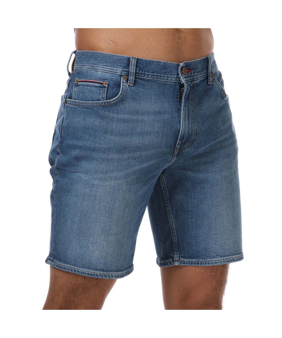 Mens Tommy Hilfiger Denim Shorts in denim.- Button and zip closure.- Five-pocket styling.- Fading on front and back.- Tommy Jeans branding.- Tommy Jeans flag patch on back.- Stretch cotton denim.- Slim fit.- 99% Cotton  1% Elastane.- Ref: MW0MW180351A9