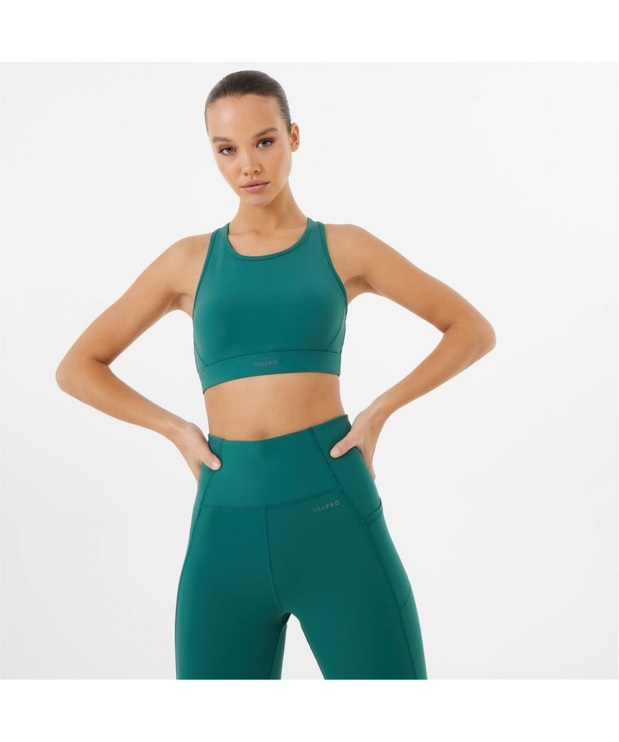 Let your modern sportswear take centre stage with this sports bra. Designed with racer back, scoop neckline, stretch elasticated underband and wicking sweat away whilst keeping you dry, so there’s nothing standing in the way of you and your workout. This medium support bra is perfect for cardio, weight-lifting, cycling and other medium impact sports. This will be sure to bring your athleisure up a notch. Sweat it out and keep cool in the USA Pro. Please note: Style may vary > Sweat wicking > Pro-dry > Built-in bra > Mid support > Original styles: 90% Polyamide and 10% Elastane > New styles: 78% Polyester and 22% Elastane > Power mesh: 88% Polyester and 25% Elastane > Machine washable > Style: Low Impact Sports Bras > Underwire: Non Wired > Fastenings: Pull Over > Materials: Polyester > Adjustable Straps: No > Strap Type: Racerback Straps > Padding: Removable Pads > Care Instructions: Follow Care Instructions