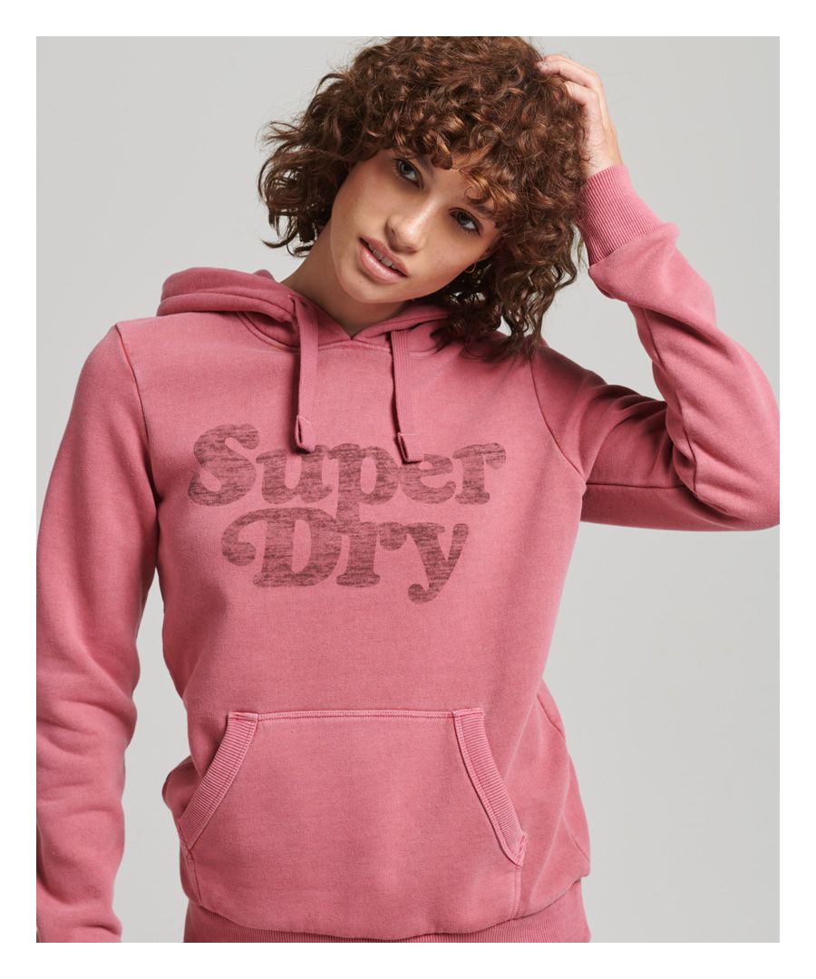American style has influenced our vintage range with its workwear origins and decades of athletic history. Iconic designs like the hoodie were moulded by the generations of sports that brought the west together, and we've been inspired by that to create a homage in the form of our cooper classic hoodie. It features our name in a bold, retro knit on a timelessly comfortable hoodie design. It's considered a classic for a reason - reliable, simple, and luxuriously soft for effortless wear.Relaxed fit – the classic Superdry fit. Not too slim, not too loose, just right. Go for your normal sizeLined hood with drawcord adjustmentLong sleevesRibbed trimsFront pouch pocketBrushed liningSignature Superdry tab'None Better' fade print, surrounding a raised print 'Superdry' in bubble letter font
