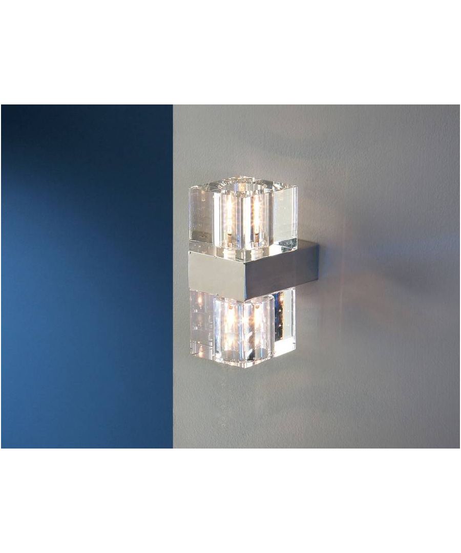 Wall lamp of 2 lights made of metal, chrome plated. Glass shade. | Finish: Chrome | Material: Metal And Glass | IP Rating: IP20 | Height (cm): 21 | Length (cm): 9 | Width (cm): 12.5 | No. of Lights: 2 | Lamp Type: G9 | Kelvin: 3000 | Lumens: 550 | Wattage (max): 42W | Weight (kg): 2.95
