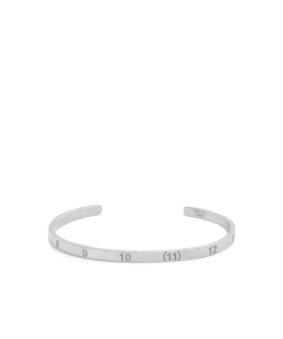 This Maison Margiela Bracelet is crafted from 925 semi polished sterling silver and consists of number engraved details, logo detail and a no closure design.
