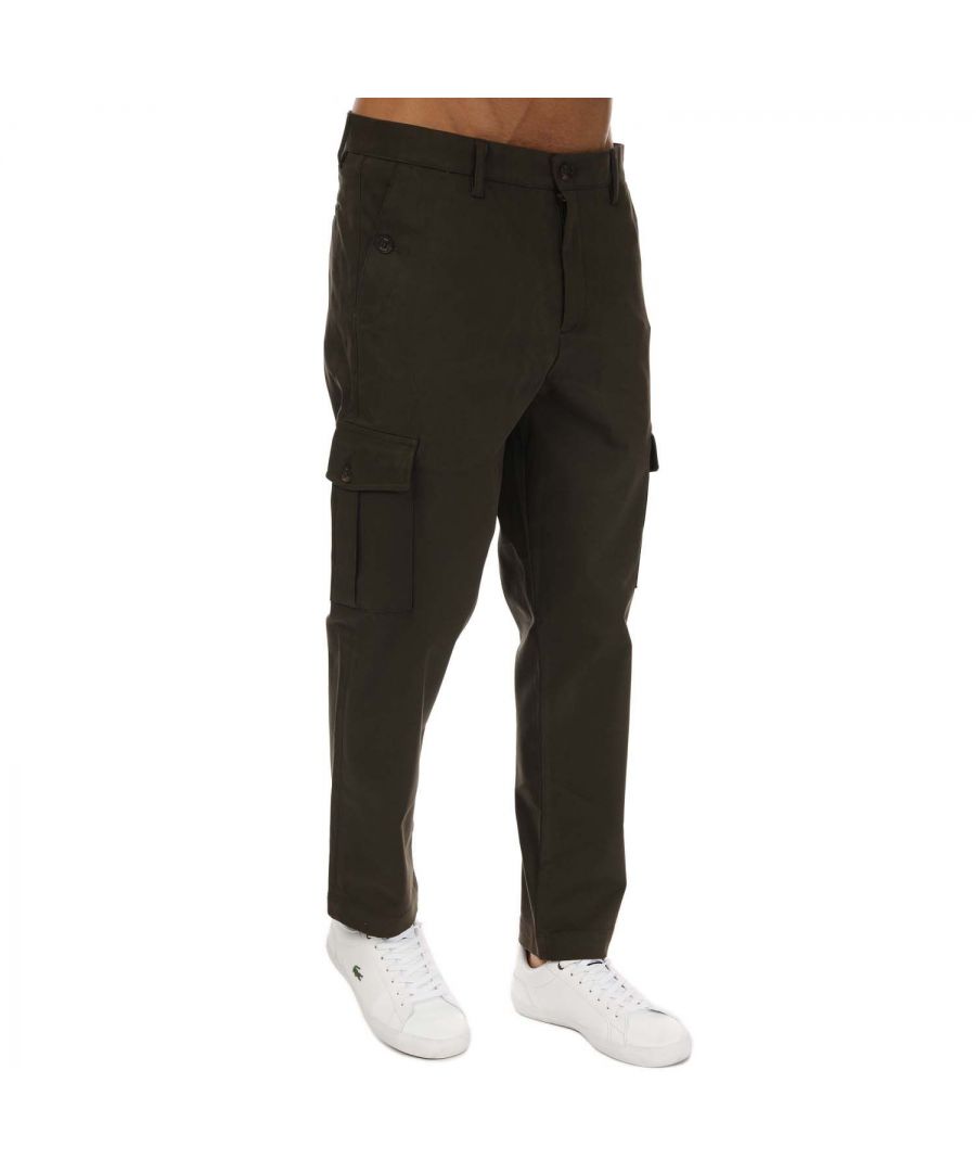 Mens Ted Baker Mikael Slim Cargo Trousers in khaki.- Double button fastening with zip fly.- Two slanted pouch pockets on the hips.- Two branded button fastening pockets on the reverse.- Six belt loops.- Top stitching.- Shell: 88% Cotton  9% Polyester  3% Elastane. Pocket: 68% Cotton  32% Polyester.- Ref: 251683KHAKIS
