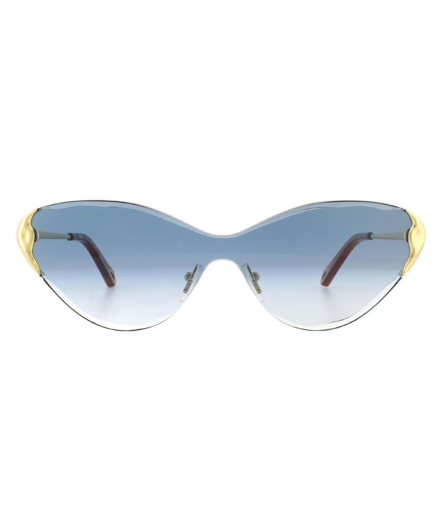 Chloe Sunglasses Curtis CE163S 816 Gold Blue Gradient are a gorgeous wide style with accentuated cat's eye look. The rimless sculptured lens is just stunning and matched perfectly with the metal temples that complete the top corners.