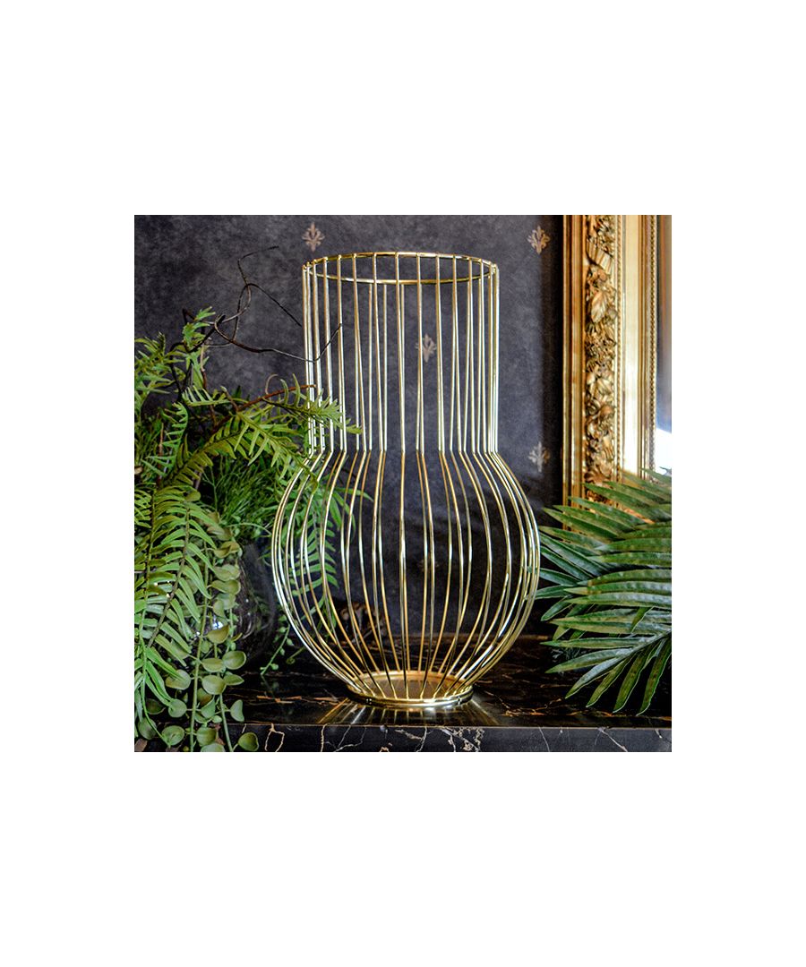 An inventive reimagining of the classic lantern, this metal wire creation can be used for decorative purposes, or to elegantly present your tealights. Its gold colouring makes this lantern ideal for adding a contemporary flourish to classic interiors or emboldening more modern decor.\n \nVivid, and glistening from every angle it’s almost too beautiful to be used. Long, and slimline, but rounded at the neck, this regal piece hints at Greek mythology, recalling tales of the benevolent Prometheus stealing fire from Olympus to gift to man.\n \nSet with a radiance that whispers the gold touch of King Midas, we bring this to you, to light up your home and reflect the warming rays of the sun. What is fit for a god must be fit for you.\n \nFeatures: \n\n\nGeometric structure\n\n\nWide vase\n\n\nMadison and Mayfair signature collection\n\n\nVivid gold colouring\n\n\n \nProduct specification:\n\n\nProduct Type: Lantern\n\n\nWeight: 0.75kgs\n\n\nDimension: 35cm x 22.5cm x 22.5cm