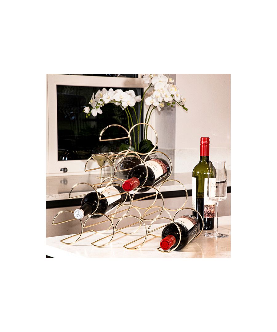 An inventive reimagining of the classic wine rack, this metal wire creation can be used for decorative purposes, or to elegantly present your wine collection. Its gold colouring makes this rack ideal for adding a contemporary flourish to classic interiors or emboldening more modern decor.\n \nImpress guests with this opulent gold piece, whether utilised as a wine rack or a standalone vision of abstract, geometric art. Its gold colouring makes this wine rack ideal for adding a contemporary flourish to classic interiors or emboldening more modern décor.\n \nSturdier than it might seem, this wire rack can hold up to 10 bottles of your favourite tipple. Dress up any kitchen surface with this truly unique piece, or position creatively in your living room, ideally within eyeshot, as a fun reminder of better things to come!\n \n \nFeatures: \n\n\nDesigned to inspire\n\n\nCreative reimagining of wine rack\n\n\nAs a standalone art piece\n\n\n 