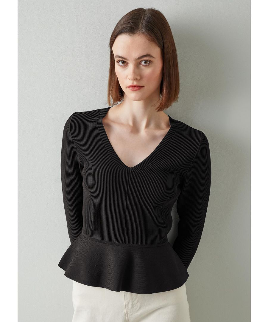 A great transitional knit, our Louise jumper is simple, shapely and stylish. Crafted from a stretch ribbed knit in classic black, it has a V-neck, centre seam detail, long sleeves and is finished with a plain knit peplum hem. Wear it with jeans on days when a tee is too light and a classic knit is too heavy.