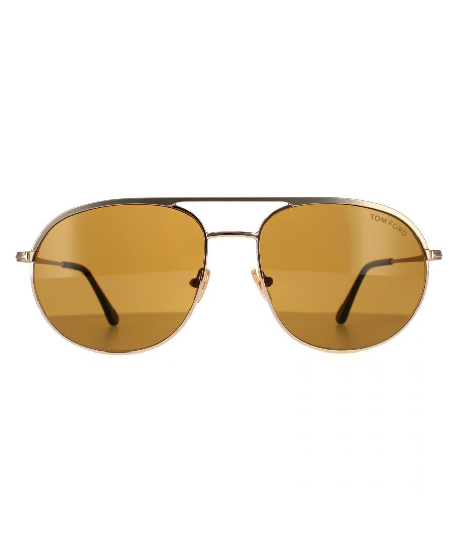 Tom Ford Aviator Mens Matte Rose Gold Brown Sunglasses Gio FT0772  are a sleek aviator design crafted from lightweight metal. Plastic temple tips, silicone nose pads and a robust double bridge provide comfort for all day use. Tom Ford's iconic 