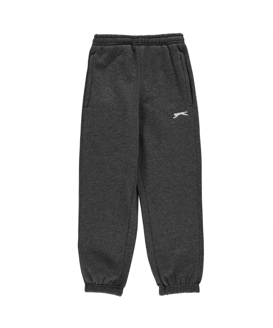 Slazenger Fleece Pants Junior - These Slazenger Junior Fleece Sweat Pants feature an elasticated waist band with a drawstring fastening for a secure fit. While the minimalistic design keeps them fashionable and simple, the fleece lining makes them super cosy, alongside the elasticated cuffs for a great combination of warmth and comfort. The look is then completed with Slazenger branding on the front. Do not miss out on these ones.  > Boys Jogging Bottoms > Sweat Pants > Drawstring fastening > Classic > Brushed fleece lining > Two open pockets > Piped detail > Regular fit > Stitching detail > Elasticated waist > Keep away from fire > Slazenger branding > 65% Polyester 35% Cotton > Machine washable at 40 degrees