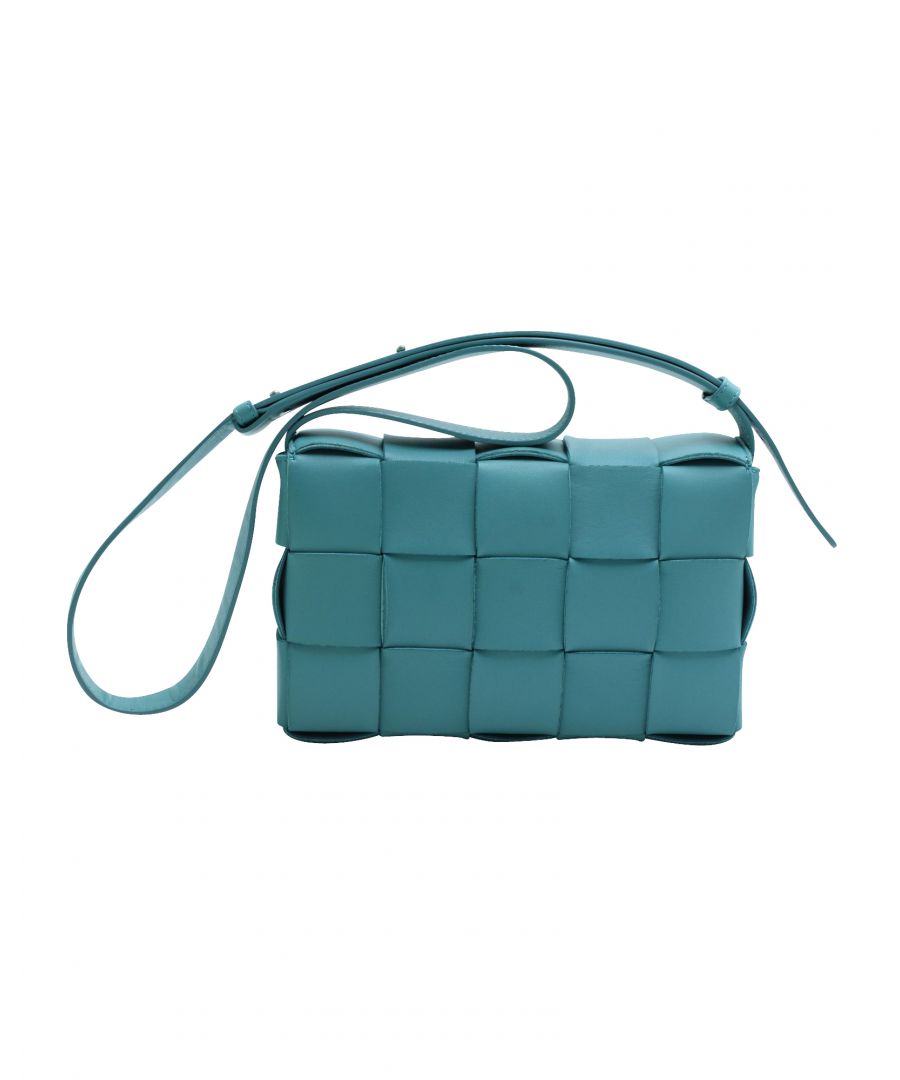VINTAGE, RRP AS NEW\nA bag that took the fashion world by storm, Bottega Veneta’s Cassette reflects creative director Daniel Lee’s distinctive style choices. From the label’s Fall/Winter 2019 collection, the creation is seen with every other supermodel, influencer, or celebrity. With its playful take on the brand's signature house code - the Intrecciato weave, the bag's exterior flaunts a maxi version of the pattern. It is crafted from quality leather in a lovely shade of blue. The creation is finished off with a slender strap.\n\nBottega Veneta Cassette Cross Body Bag in Blue Leather\nCondition: Excellent, with card and dust bag\nSign of wear: No\nColor: Blue\nMaterial: Leather\nDimensions:  Length: 220 mm, Width: 60 mm, Height: 140 mm \nSKU: 147233 / NAPBKGBBA106023W