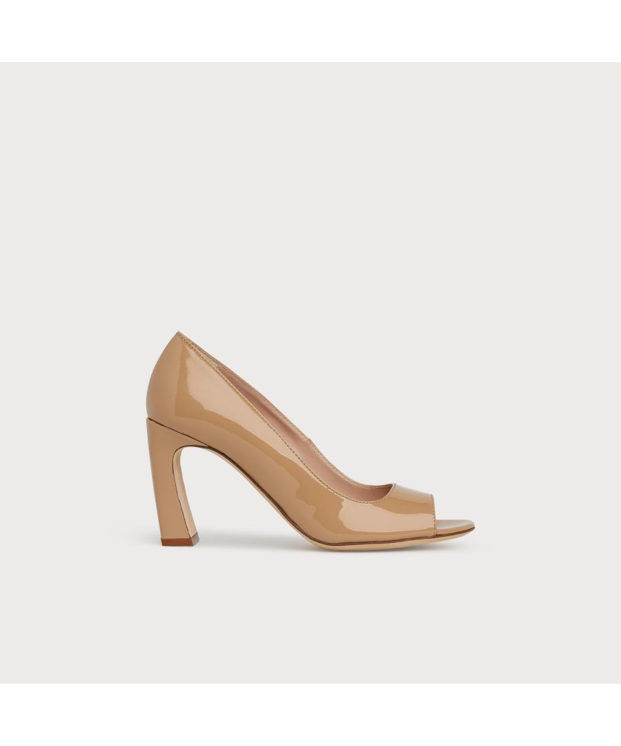 A contemporary take on a classic peeptoe, our Harper courts are ready for the spring/summer season. Crafted in Italy from nude patent leather, they have a peeptoe front, sleek silhouette and an inverted curve 85mm block heel. Versatile and stylish, wear them instead of your usual courts when the sun shines.