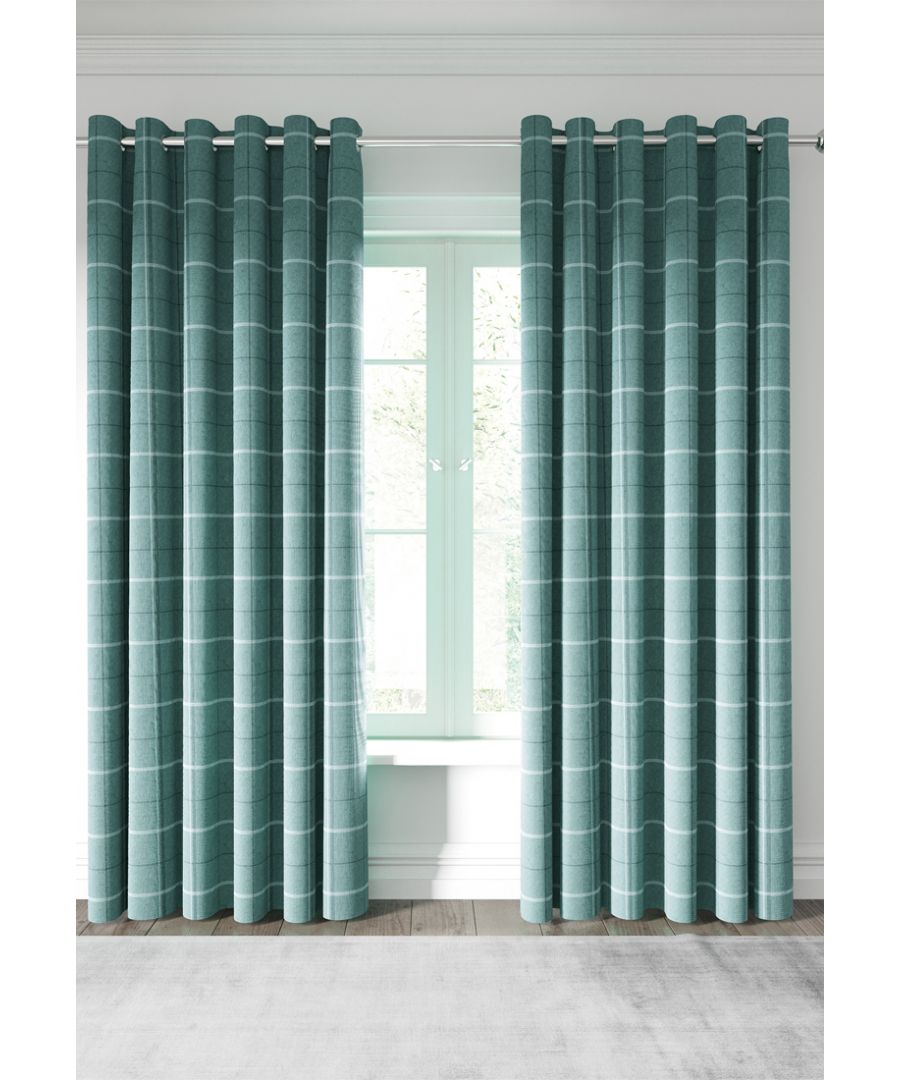 A woven windowpane check curtain, beautifully tailored to give a classic interior feel.  Choose from a choice of soft duck egg blue, subtle silver, statement navy or striking charcoal and ginger. A gently textured design with matte silver eyelets. 100% polyester with 100% polyester lining in ivory. Dry Clean Only. Made in China