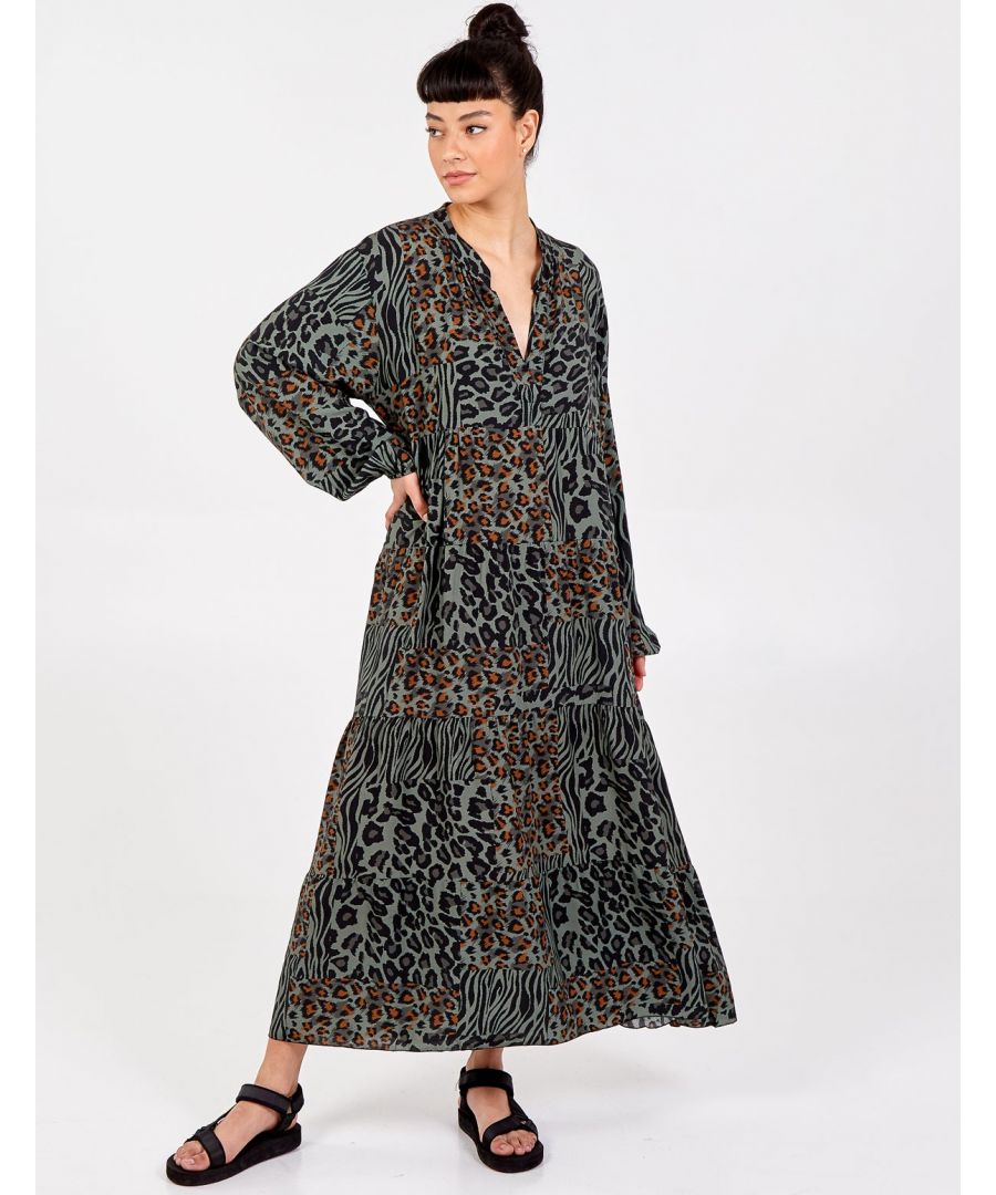 Take a walk on the wild side with this bold leopard print dress. The classic fit and flare shape is perfect for everyday wear.,  Style with a leather biker jacket for an edgy look.