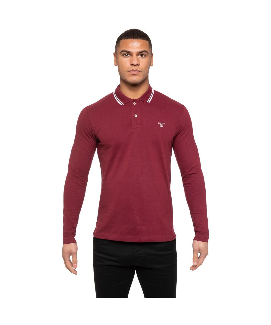 Gant Mens Designer Long Sleeve Polos feature the brands Logo, a Contrasting Trim and a Button-Down Collared Neckline. Crafted With 100% Cotton, these Lightweight and breathable Regular Fit Polos are Suitable for Casual or Workwear.