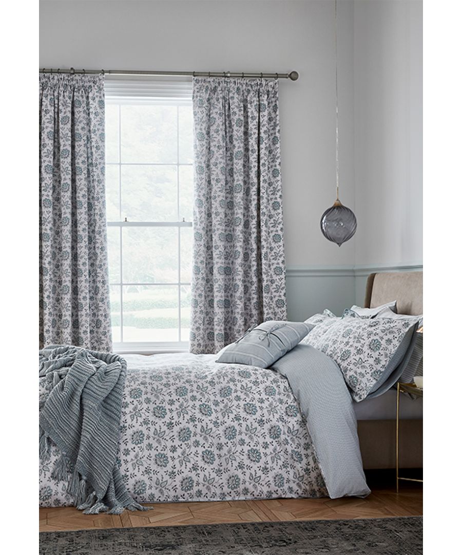 This lively stylised floral design oozes freshness in calming celadon and grey on a soft white base.  The small-scale geo reverse with tiny dot detail adds interest. The main bed design also graces the matching curtains to further enhance the Cherine collection. Made in Pakistan.