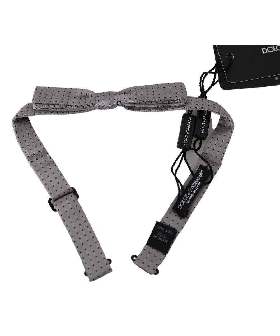 DOLCE & GABBANA\nAbsolutely stunning, 100% Authentic, brand new with tags Dolce & Gabbana Bow Tie.\n\nColor: Gray Polka dot patterned\nModel: Tied\nMaterial: 100% Silk\nWidth: 2cm\nAdjustable length neck strap, one size\nMade In Italy