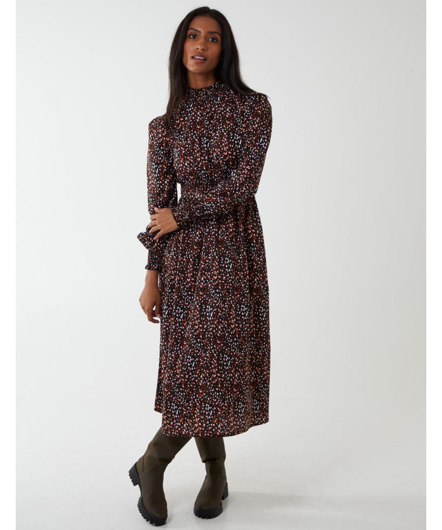 Brighten up those cold days with this midi dress. This abstract print dress with elasticated cuffs and shirring details will keep you up to date with the latest trends. Pair with knee high boots and a teddy coat for statement style. \n100% polyester 