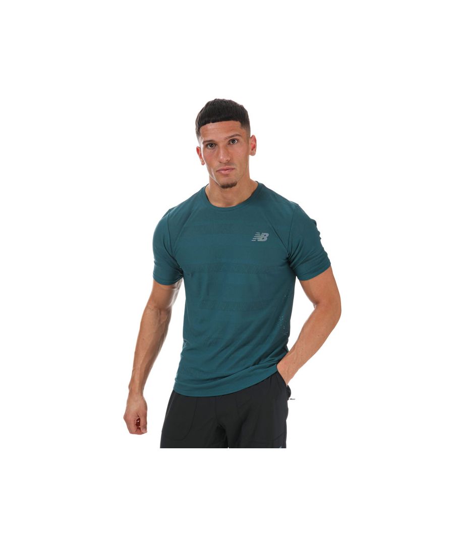 Mens New Balance Q Speed Jacquard T- Shirt in blue.- Crew neck.- Short sleeves.- NB ICEx fast-drying technology helps you stay cool.- Soft jacquard knit fabric for comfort.- Curved hem.- Athletic fit built to skim your chest  waist and hip.- 73% Polyester  27% Elastane. Machine washable.- Ref: MT13277MTL