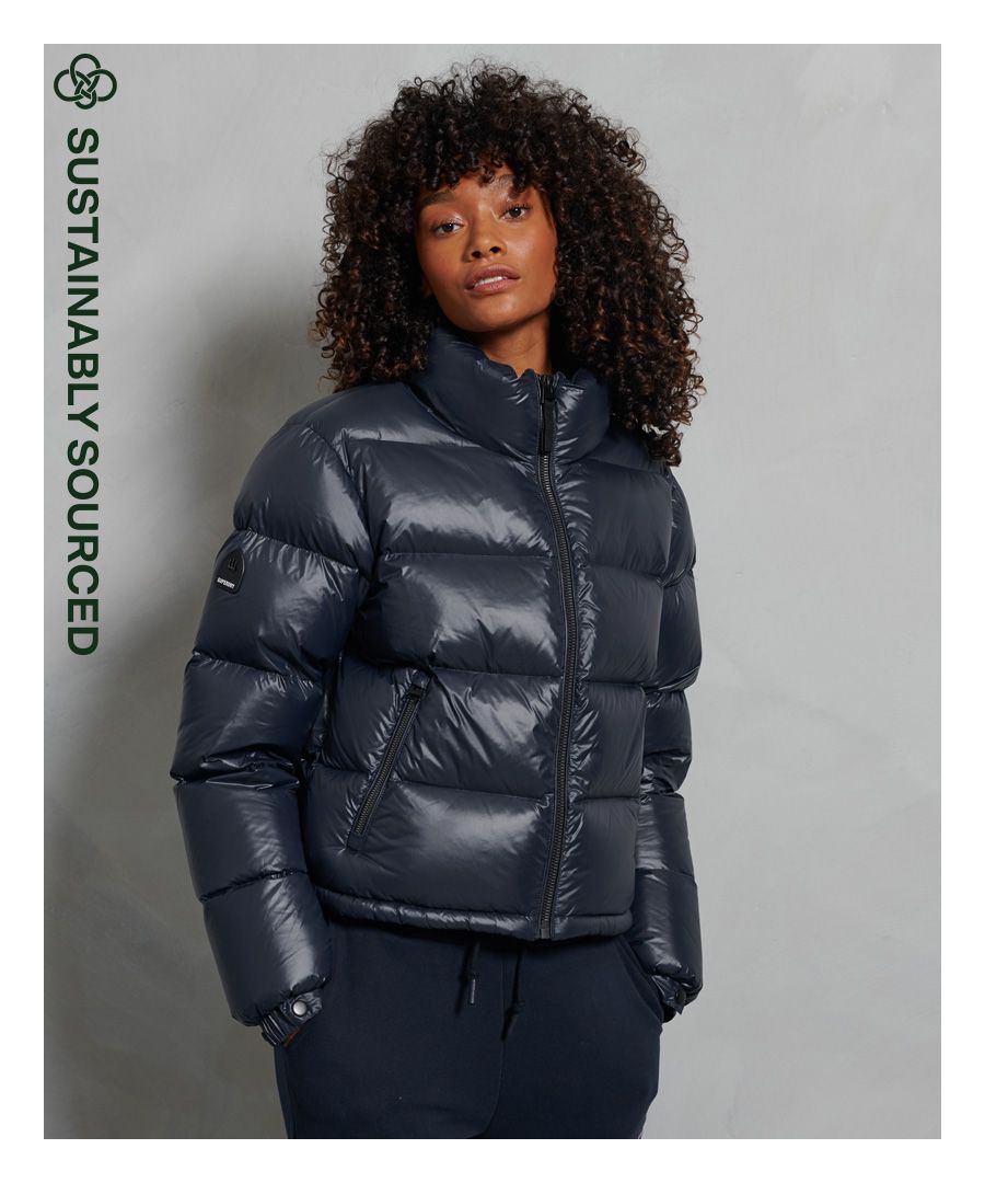 Stay warm in style this season. This padded jacket has been filled with a 90/10 down filling for extra comfort and warmth. Available in a variety of colours so that you can pick which one best suits your style.Main zip fastening90/10 down fillingTwo pocket designBungee cord hemElasticated popper cuffsSignature logo badgeSuperdry is certified by the Responsible Down Standard, products certified to the responsible down standard contain down or feathers from farms certified to animal welfare requirements.