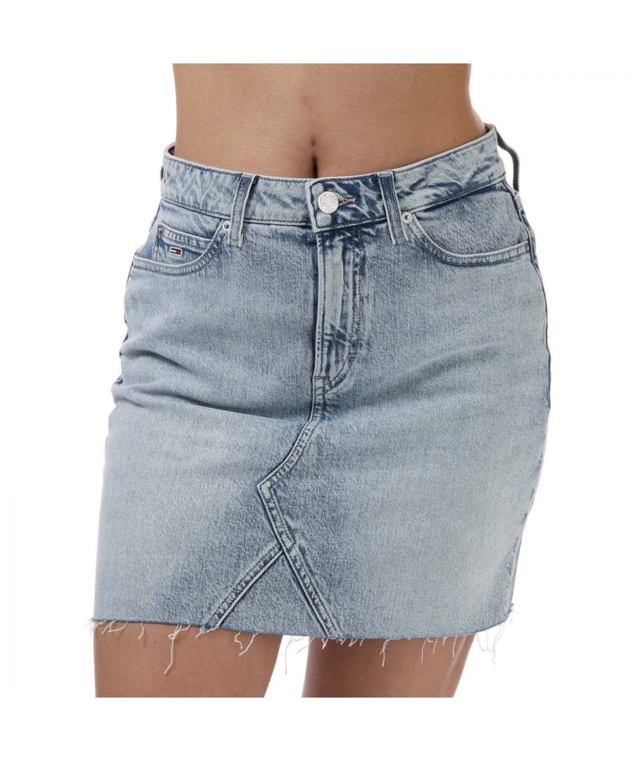 Womens Tommy Hilfiger Denim Skirt in denim.- Five-pocket styling.- Zip fly and button fastening.- Belt loops.- Tommy Jeans branding.- Tommy Jeans flag patch on coin and back pocket.- All-over faded pattern and the decorative stitching on the front.- Regular cut.- 99% Cotton  1% Elastane.- Ref: DW0DW101021AB