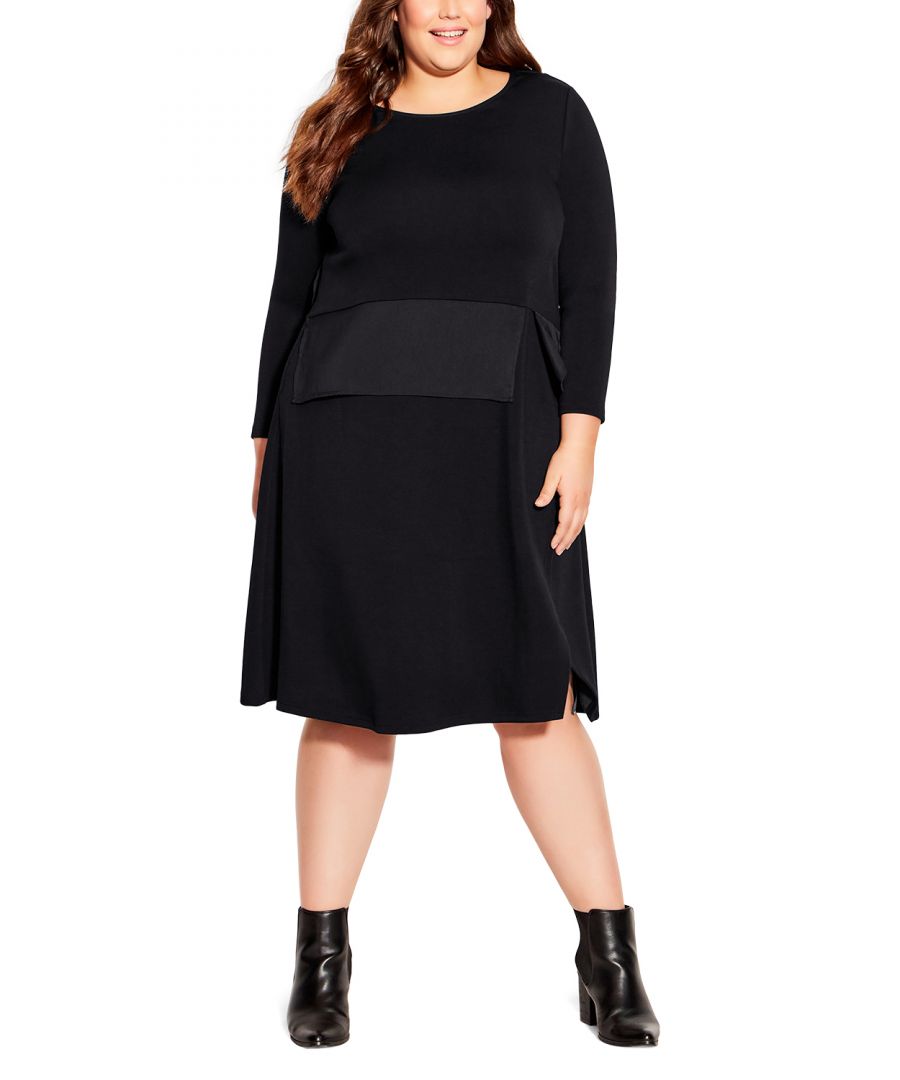 Level up your look with the bold detailing of the Beyond Knit Dress! Bringing a chic touch to a classic black dress, you'll be ready for work or play in this relaxed style with an asymmetrical side split hemline and contrast trim waistband. Key Features Include: - Round neckline - Full length sleeves - Relaxed waistline - Asymmetric contrast waist trim - Functional side pockets - Midi length with split side detail
