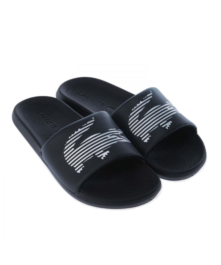Mens Lacoste Croco Slide Sandals in black silver.- Synthetic upper.- Slip on closure.- Black colourway with silver branding to the straps.- Grippy footbed and sole.- Synthetic rubber construction.- Synthetic upper  Synthetic lining and sole.- Ref.: 742CMA002322F