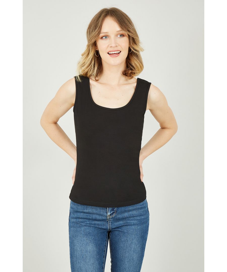 Some might say basic, we say essential. The Yumi Black Vest Top will be to most worn piece in your wardrobe this year. The 100% cotton top is breathable, soft and so versatile. The classic fit has a scoop neck and is cropped at the hip. Wear with your favourite pair of jeans or denim skirt and trainers for an effortless look. Our favourite way to wear is with jeans and a long kimono for those cool spring afternoons.