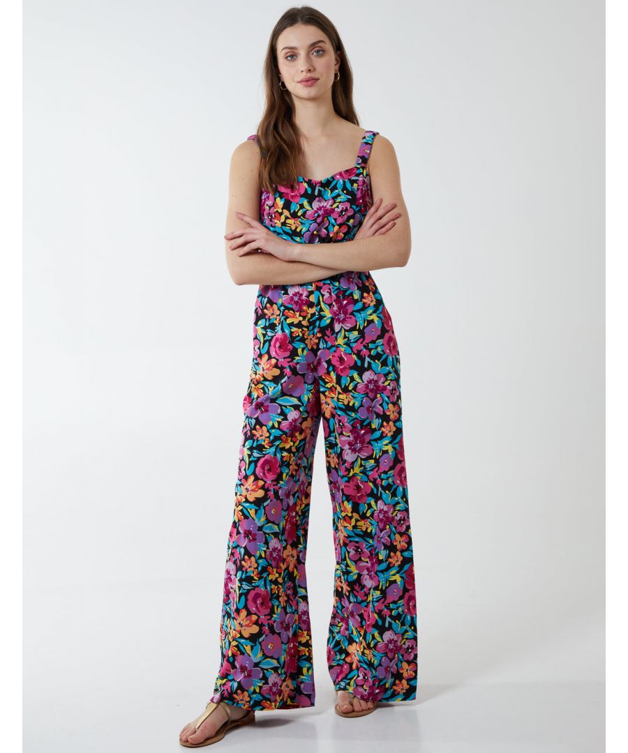A jumpsuit is a must have for this summer and you can't go wrong with this floral tropical all in one!. Dress up with a pair of heeled sandals for off duty look.\n100% Polyester Made in ChinaMachine washable Square neckline Sleeveless Approx length 128 cm Back zipModel wears size 8Model height: 5,€™9,€ / 175cm