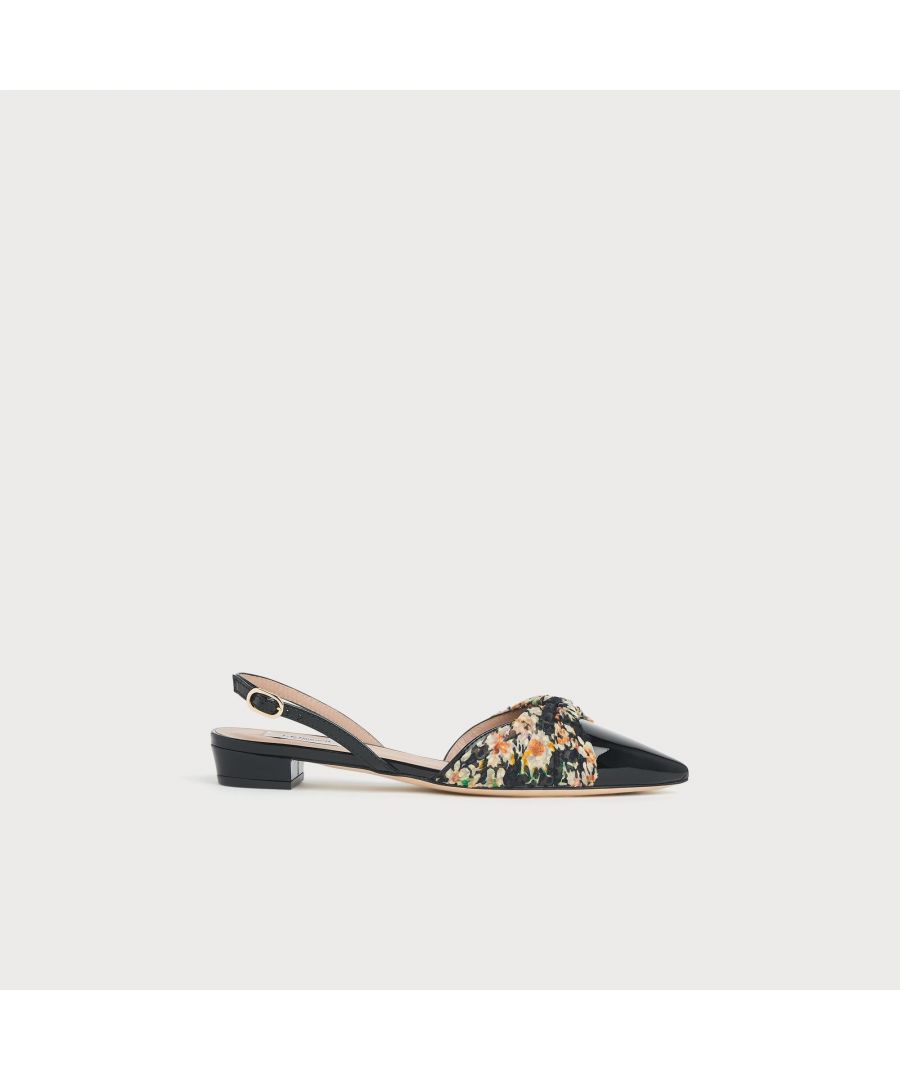 An elegant pairing of floral print chiffon in a vintage archive design and glossy black patent leather, our Parker pumps are expertly-crafted in Italy. They have a pointed toe, a twist of fabric over the foot - which matches with pieces in our clothing collection - and have a buckle slingback and a small flat heel. Wear them with a pair of tailored trousers and a silk blouse.