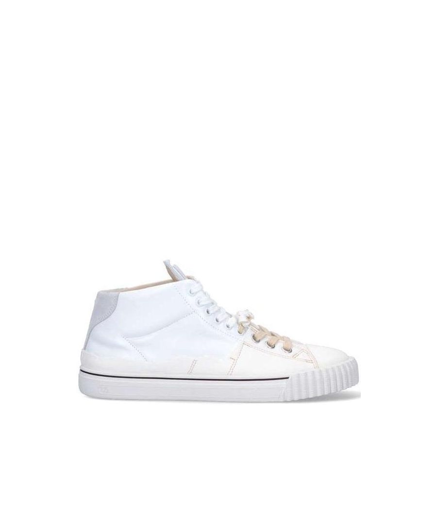 These Maison Margiela High Top Trainers have canvas inserts, tongue with iconic Margiela numerical logo, round rubber tip, lace-up closure and ribbed detail sole.