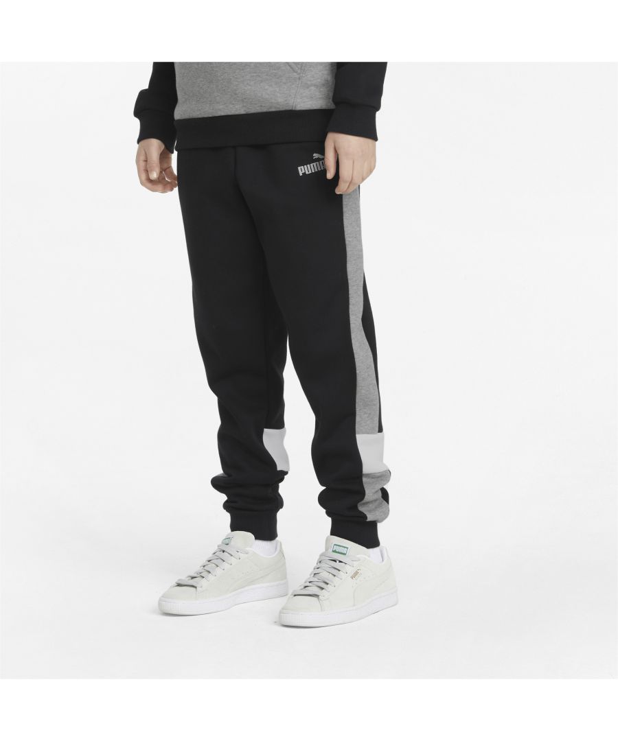 Junior Puma Essentials Colourblock Sweatpants in black.- Elasticated waist with inner drawcord.- Two front pockets.- Ribbed ankle cuffs.- Printed branding.- Regular fit.- Shell: 66% Cotton  34% Elastane. - Ref:84908301J