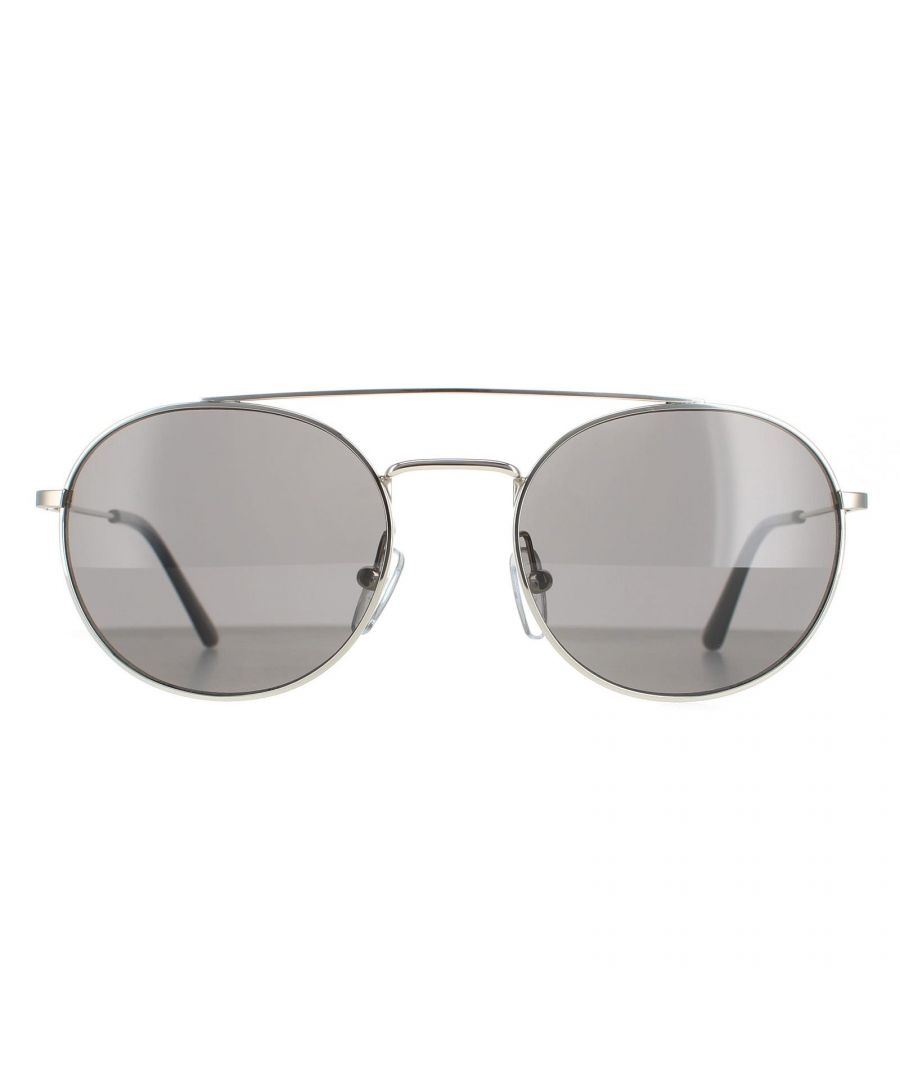 Calvin Klein Round Unisex Silver Grey CK18116S CK18116S are a modern round style crafted from lightweight metal. The silicone nose pads and double bridge ensure an all round comfortable fit. Slender temples feature the Calvin Klein logo for authenticity.