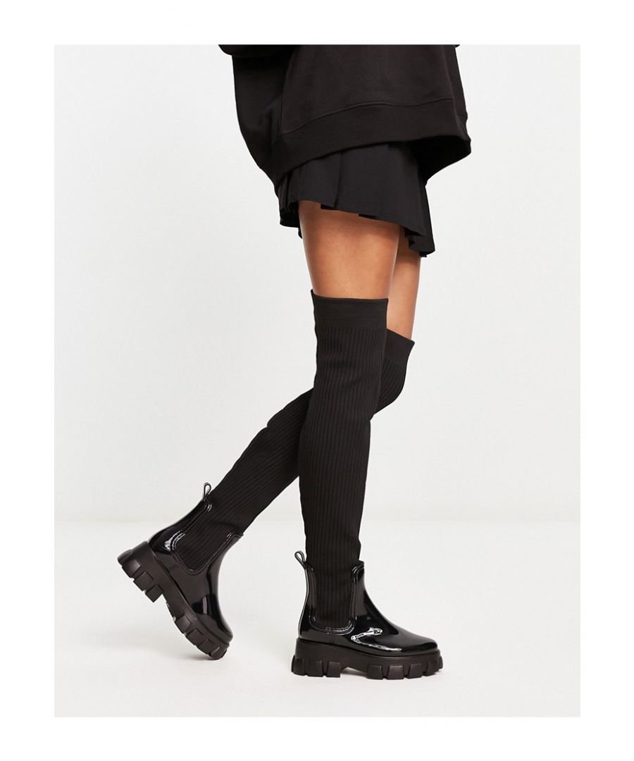 Wellies by ASOS DESIGN Compliments: incoming Pull-on style Pull-tab for easy entry Round toe Chunky sole Lugged tread Sold by Asos