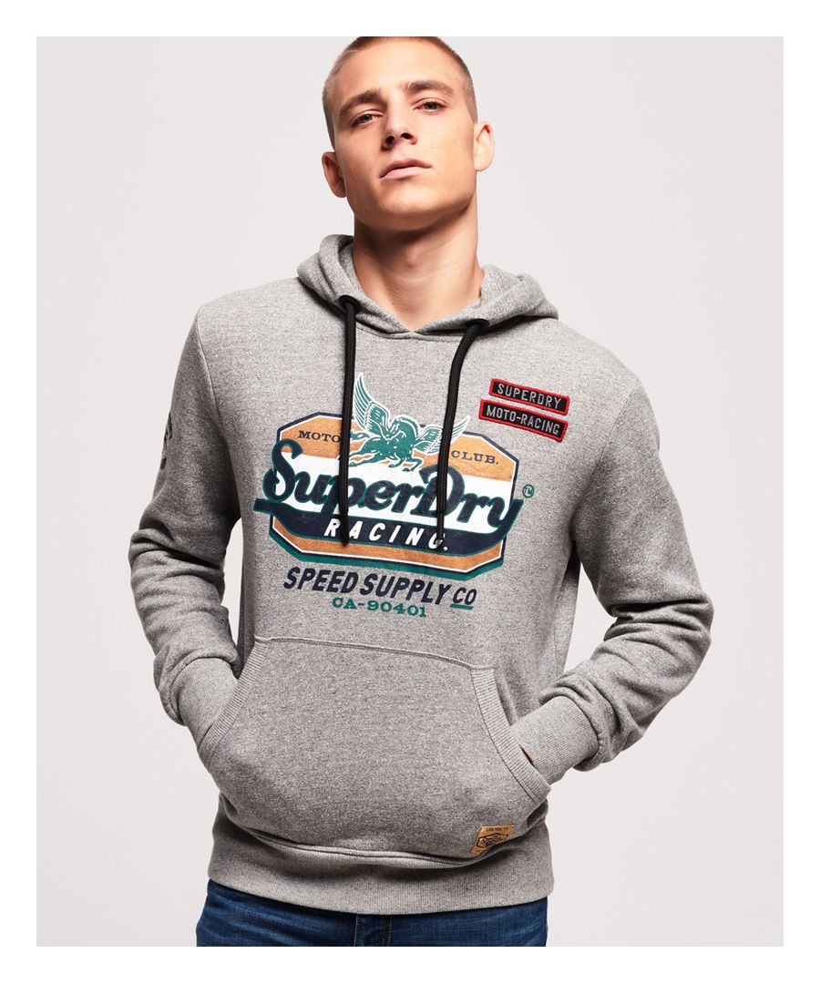 Superdry men’s Custom 1334 hoodie. Find that balance between cool and casual with the Custom 1334 hoodie. This overhead hoodie features a drawstring adjustable hood, ribbed cuffs and hem and a large Superdry logo across the chest in a cracked effect finish. The Custom 1334 hoodie is completed with embroidered Superdry logo detailing on one sleeve and a Superdry logo badge on the front pouch pocket.
