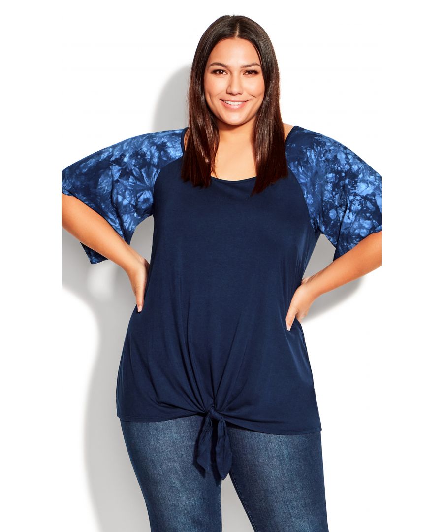 Looking for a top that's both comfortable and chic? Look no further than the Gemma Tie Front Top. The contrasting sleeves add a touch of glamour to this relaxed silhouette, while the stretch fabric hugs your curves for a flattering fit. Dress it up with a pair of jeans and heels or keep it casual with leggings and sneakers. Either way, you'll love the way you look in this trendy top. Key Features Include: - Scoop neckline - Short sleeves - Pull-over style - Contrast fabrication on sleeves - Stretch fabrication - Tie front hemline