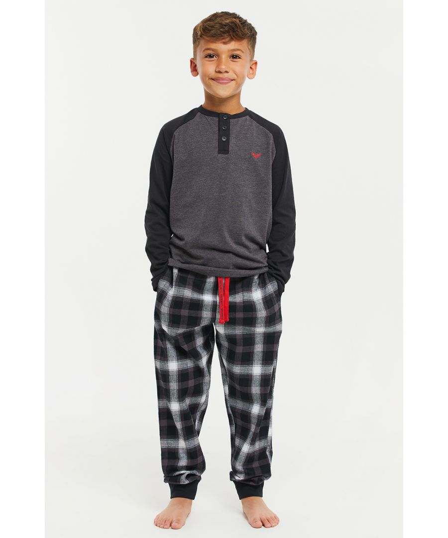 This cotton pyjama set from Threadboys features a long sleeve top with a grandad collar and long flannel bottoms. The bottoms have an elasticated waistband with drawstring and cuffed legs. Made from cotton to ensure a comfortable feel, other styles are also available.