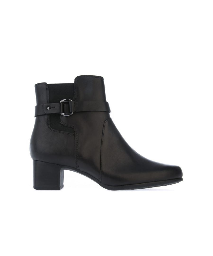 Womens Clarks UN Damson Mid Leather Boots in Black. – Leather upper. – Zip fastening. – Strap and Silver hardware. – Waterproof. – C-Shell technology. – Elasticated panel. – Rubber sole. – Leather upper – Textile lining – Synthetic sole. – Ref: 26144675