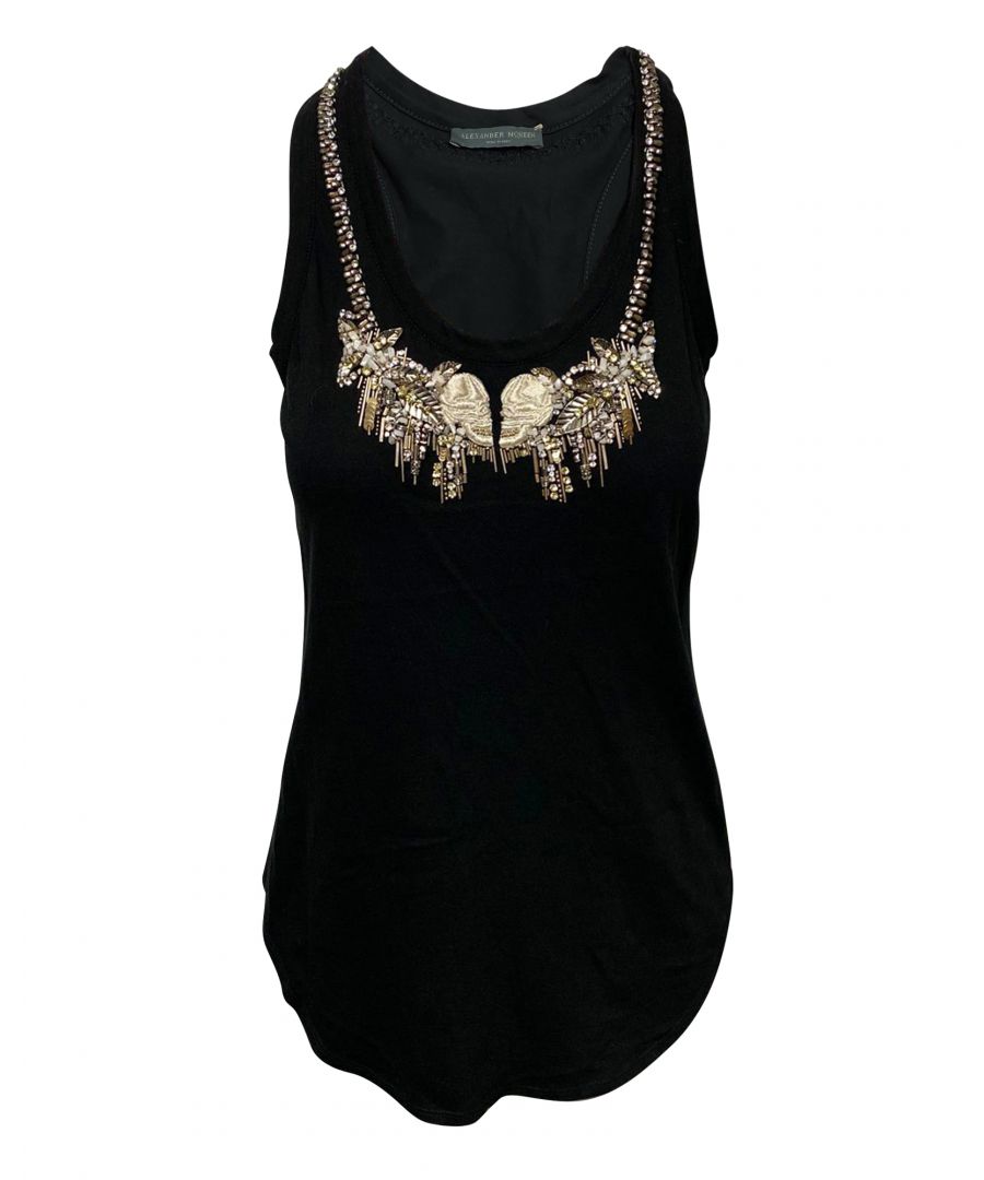 VINTAGE. RRP AS NEW. This Alexander McQueen tank top is not your ordinary tank top. Made from black cotton, this top features a round neckline, racerback, and gold embellishments around the neckline for added glamour. The gold embellishment in this top is what makes it look radiant and flashy. Pair this top with a good pair of jeans for an easy glamourized casual look.\n\nAlexander McQueen Embellished Tank Top in Black Cotton\nColor: black\nMaterial: Cotton\nCondition: very good, with minimal damages on embellishments\nSize: IT40/UK8/FR36/XS\nSign of wear: No\n\n\n\n\nSKU: 91427   \nDimensions:  Length: 700 mm