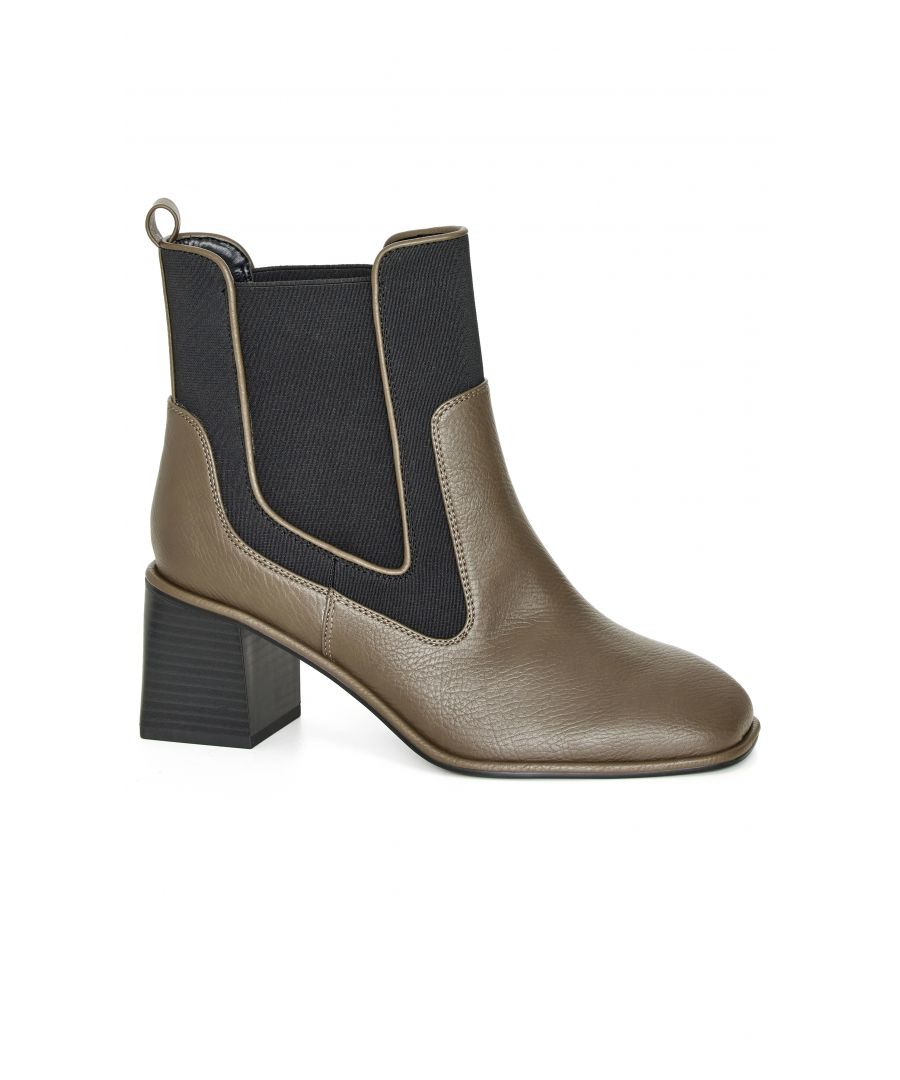 Stay on trend with the Benxo Ankle Boot. Comfort meets style with the cushioned insoles and square toe design. Key Features Include: - Square toe - Extra wide fit - Cushioned insole - Chelsea boot pull-on style - Square wood stacked heel - Faux leather fabrication with black elastic contrast Elevate your look with a cropped jean.